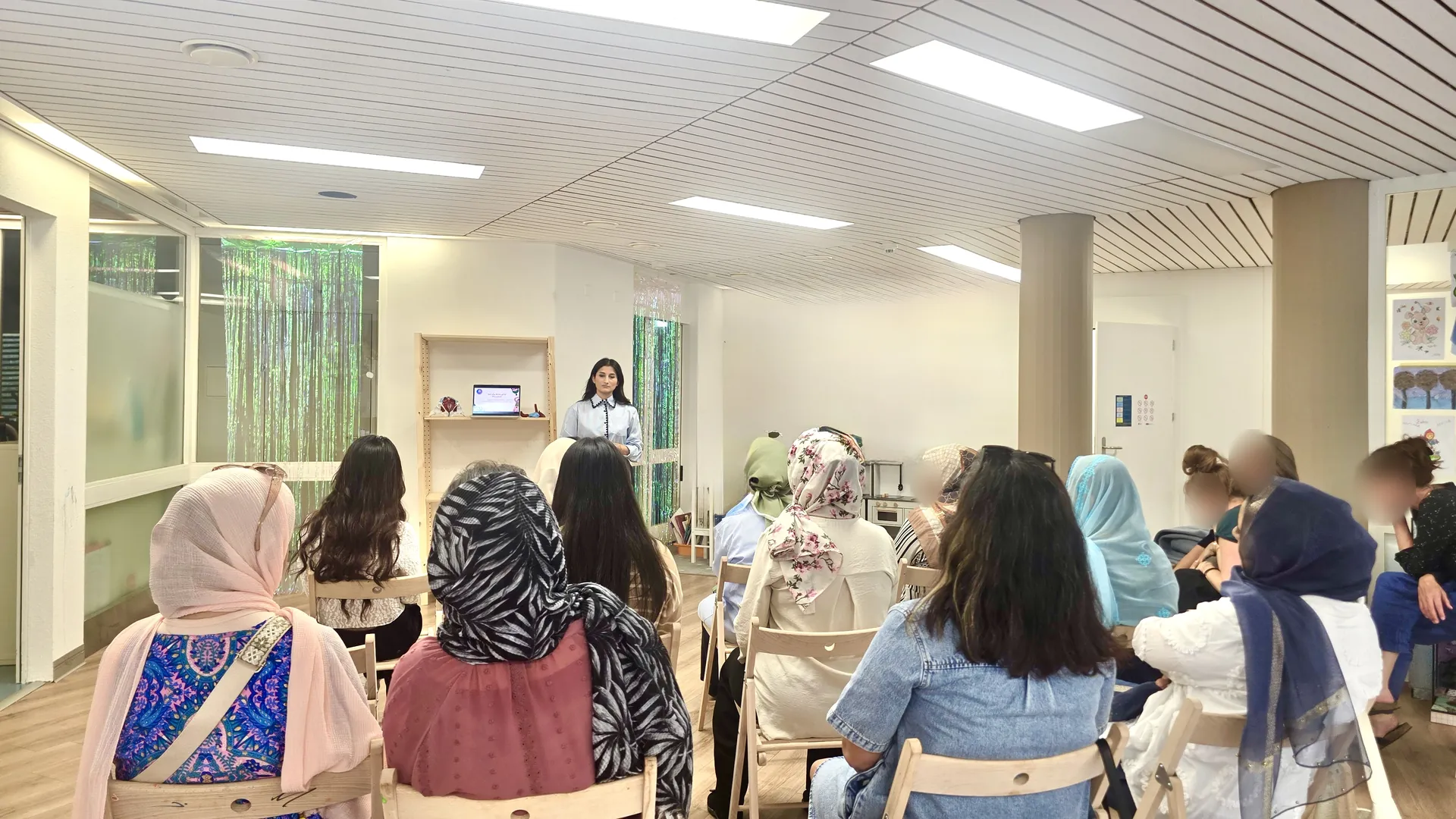 Women listening to a speaker at a Your Body Matters workshop